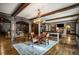 Basement game room with large wood table and antler chandelier at 833 Hines Rd, Moreland, GA 30259
