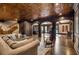 Open floor plan basement with bar and lounge areas at 833 Hines Rd, Moreland, GA 30259