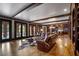 Bright basement rec room with leather sectional and access to backyard pool at 833 Hines Rd, Moreland, GA 30259