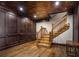 Elegant wood staircase leading down to a finished basement at 833 Hines Rd, Moreland, GA 30259