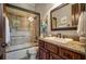 Clean bathroom with a shower/tub combo and granite vanity at 833 Hines Rd, Moreland, GA 30259