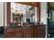 Elegant bathroom with dark wood vanity, marble countertops, and large mirror at 833 Hines Rd, Moreland, GA 30259