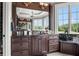 Bathroom features a marble vanity, large windows and a walk-in shower at 833 Hines Rd, Moreland, GA 30259