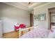 Bright bedroom with hardwood floors and flamingo bedding at 833 Hines Rd, Moreland, GA 30259