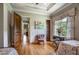 Light and airy bedroom with hardwood floors and built-in shelving at 833 Hines Rd, Moreland, GA 30259