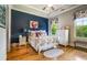 Charming bedroom with hardwood floors and a view of the backyard at 833 Hines Rd, Moreland, GA 30259