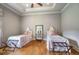 Spacious bedroom with hardwood floors and twin beds at 833 Hines Rd, Moreland, GA 30259