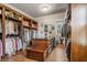 Large walk-in closet with ample shelving, drawers, and hanging space at 833 Hines Rd, Moreland, GA 30259