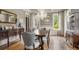 Formal dining room featuring hardwood floors, chandelier, and sideboard at 833 Hines Rd, Moreland, GA 30259