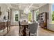 Elegant dining room with hardwood floors, chandelier, and built-in hutch at 833 Hines Rd, Moreland, GA 30259