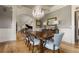 Bright dining room with hardwood floors, chandelier, and views to entry at 833 Hines Rd, Moreland, GA 30259