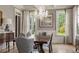 Formal dining room with hardwood floors, chandelier, and large windows at 833 Hines Rd, Moreland, GA 30259