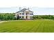 Elegant two-story home with manicured lawn at 833 Hines Rd, Moreland, GA 30259