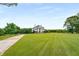 Landscaped front yard leading to a stately home at 833 Hines Rd, Moreland, GA 30259