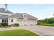 Three-car garage with extra storage space and a side entrance at 833 Hines Rd, Moreland, GA 30259