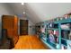 Bright hallway with hardwood floors and built-in shelving at 833 Hines Rd, Moreland, GA 30259