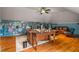Large home office, hardwood floors, built-in bookshelves, and comfortable seating area at 833 Hines Rd, Moreland, GA 30259