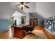 Spacious home office with built-in bookshelves and hardwood floors at 833 Hines Rd, Moreland, GA 30259