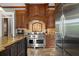 Modern kitchen with stainless steel appliances and custom cabinetry at 833 Hines Rd, Moreland, GA 30259