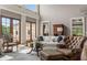 Living area with a comfortable seating arrangement and large windows at 833 Hines Rd, Moreland, GA 30259