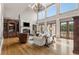 Spacious living room with hardwood floors, fireplace and large windows at 833 Hines Rd, Moreland, GA 30259