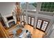 High-ceilinged living room with a chandelier and fireplace, seen from above at 833 Hines Rd, Moreland, GA 30259