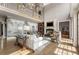 Spacious living room features a two-story ceiling, a fireplace, and large windows at 833 Hines Rd, Moreland, GA 30259