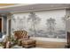 Living room showcasing a serene landscape mural and leather armchairs at 833 Hines Rd, Moreland, GA 30259