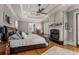 Luxurious main bedroom boasts hardwood floors, fireplace and high ceilings at 833 Hines Rd, Moreland, GA 30259