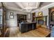 Spacious home office with built-in shelving and a fireplace at 833 Hines Rd, Moreland, GA 30259
