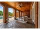 Covered patio features ceiling fan and adjacent pool access at 833 Hines Rd, Moreland, GA 30259