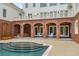 Stunning pool with brick patio and arched covered seating area at 833 Hines Rd, Moreland, GA 30259
