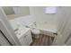 Bathroom with white tile, a tub, and a vanity at 1156 Sw Hubbard Sw St, Atlanta, GA 30310