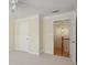 Spacious bedroom with neutral walls and carpet, and a view into the hallway at 1634 Ponce De Leon Ne Ave # 514, Atlanta, GA 30307