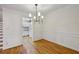 Elegant dining room featuring modern lighting, wainscoting, and an adjacent kitchen at 1634 Ponce De Leon Ne Ave # 514, Atlanta, GA 30307