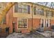 Charming townhome featuring brick and siding exterior with black shutters and tidy front entrance at 1634 Ponce De Leon Ne Ave # 514, Atlanta, GA 30307