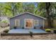 The backyard features a lovely blue patio and sliding door into the home at 1812 Defoor Nw Ave, Atlanta, GA 30318