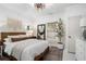 Main bedroom with wood bed frame, neutral decor, and ample natural light at 1812 Defoor Nw Ave, Atlanta, GA 30318