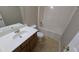 Clean bathroom with a tub, toilet and vanity at 909 Milton Cir, Loganville, GA 30052