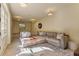 Spacious basement recreation area with sectional sofa and a large rug at 106 Peachtree Battle Nw Ave, Atlanta, GA 30305