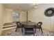 Basement game area with round table, chairs, and a dartboard at 106 Peachtree Battle Nw Ave, Atlanta, GA 30305