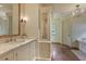 Bright bathroom with marble countertop and custom vanity at 106 Peachtree Battle Nw Ave, Atlanta, GA 30305