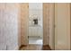 Elegant bathroom with marble vanity, patterned tile floor, and a charming window at 106 Peachtree Battle Nw Ave, Atlanta, GA 30305