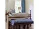 Elegant bedroom with a glimpse of a bed and blue striped bench at 106 Peachtree Battle Nw Ave, Atlanta, GA 30305