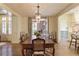 Bright dining room with French doors opening to a patio and backyard at 106 Peachtree Battle Nw Ave, Atlanta, GA 30305