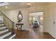 Bright entryway with hardwood floors and staircase at 106 Peachtree Battle Nw Ave, Atlanta, GA 30305