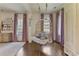 Relaxing hanging chair in bedroom with hardwood floors at 106 Peachtree Battle Nw Ave, Atlanta, GA 30305