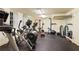 Well-equipped home gym with various exercise machines and weights at 106 Peachtree Battle Nw Ave, Atlanta, GA 30305