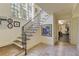 Stunning staircase with wrought iron railing and hardwood steps leading to a gym at 106 Peachtree Battle Nw Ave, Atlanta, GA 30305