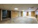 Unfinished basement with wood paneling and additional rooms at 3246 E 5 E Hwy, Carrollton, GA 30116